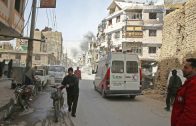 Smoke rises during evacuation in the besieged town of Douma